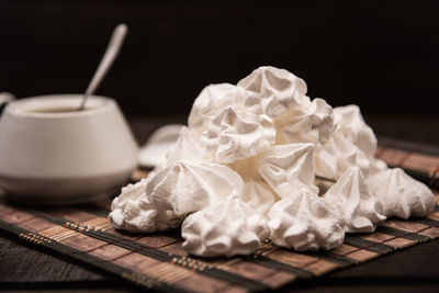 Close-up of cake on table against white background