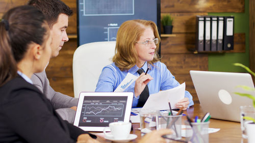 Female doctor using digital tablet in office