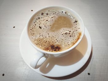 High angle view of coffee cup on table