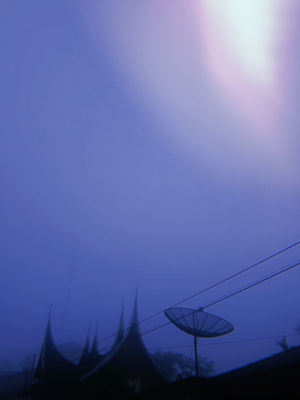 LOW ANGLE VIEW OF SILHOUETTE ELECTRICITY PYLONS AGAINST SKY AT SUNSET