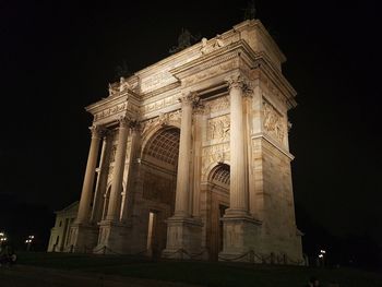 Low angle view of historical building at night