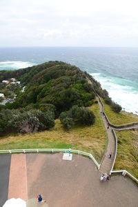 High angle view of sea and trees against sky