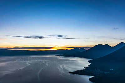 Scenic view of mountains against sky during sunset