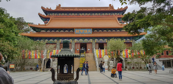 Group of people outside temple building