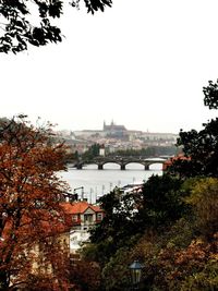 Buildings in city against clear sky