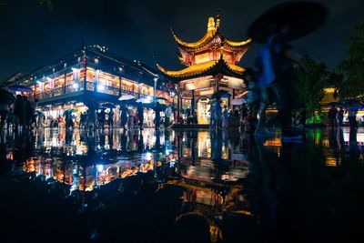 Illuminated buildings in city at night