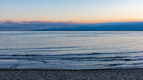 Scenic view of sea against sky during sunset