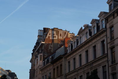 Low angle view of building against blue sky