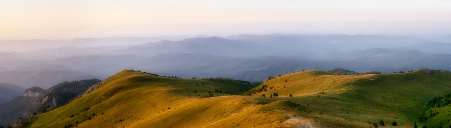 Scenic view of mountains against sky during sunset