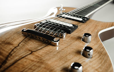 Close-up of electric guitar on table