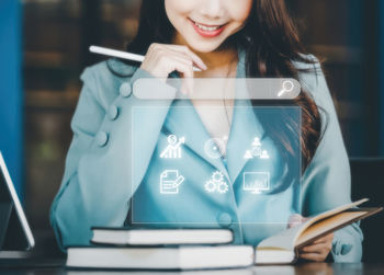 Portrait of young businesswoman standing in cafe