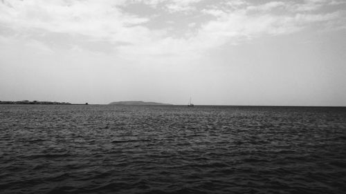 Sailboat sailing on sea against clear sky