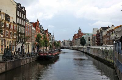 Canal amidst buildings in city