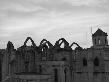 Carmo convent against cloudy sky