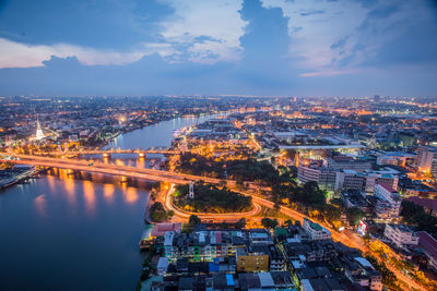 Aerial view of illuminated city at night