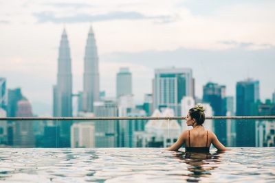 Woman relaxing in swimming pool