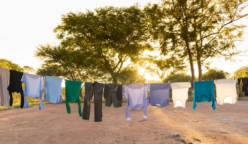 Clothes drying on clothesline against sky