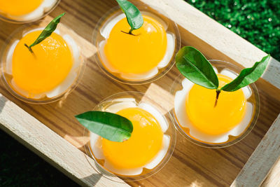 High angle view of yellow and drink on table