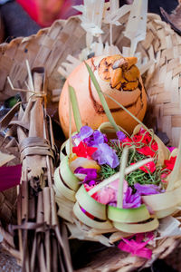 Close-up of various flowers in basket on table