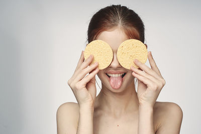 Portrait of a beautiful young woman over white background