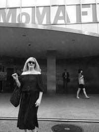 Woman standing in city