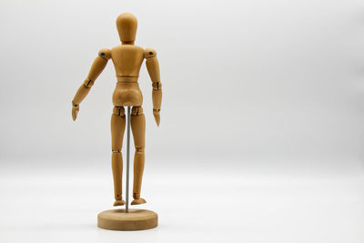 Close-up of figurine against white background