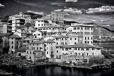 Houses in town against sky