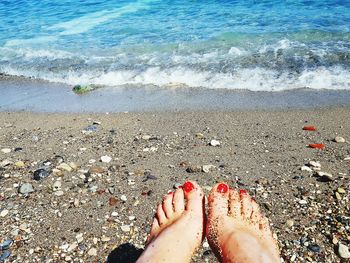 Low section of woman at beach