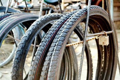 Cropped image of bicycles parked on footpath