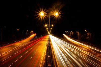 Light trails on illuminated city at night