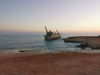 Scenic view of sea against clear sky during sunset