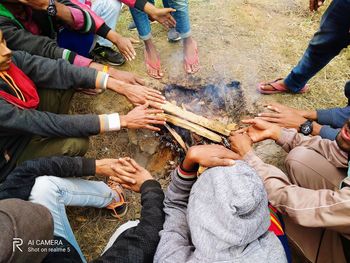 High angle view of people at hands