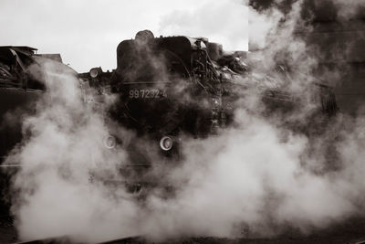 Smoke emitting from volcanic against sky
