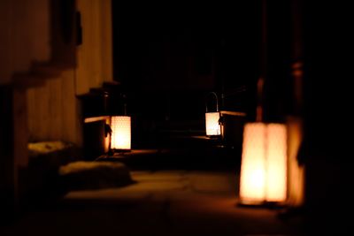 Close-up of illuminated lamp in darkroom