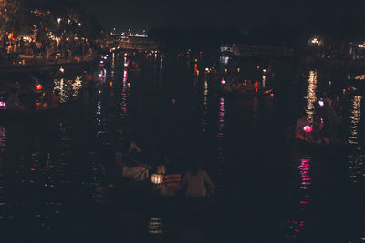 High angle view of illuminated buildings in city at night