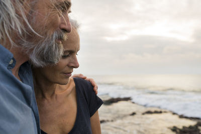 Portrait of a handsome senior couple at the sea