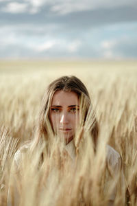 Portrait of young man in field