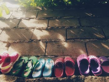 High angle view of multi colored shoes in row