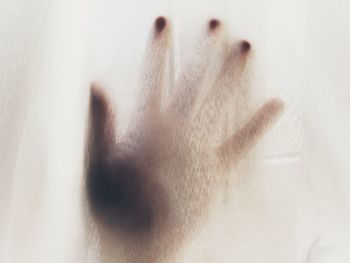 Digital composite image of hand on white background