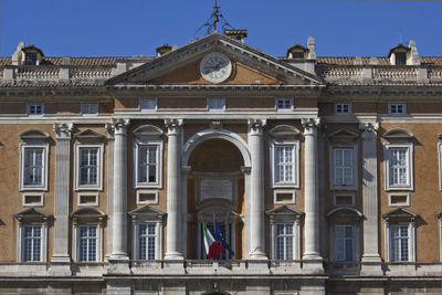 Low angle view of building against blue sky