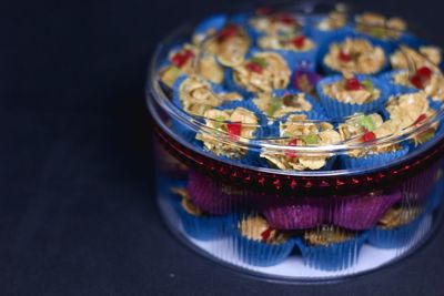 Close-up of multi colored glass on table
