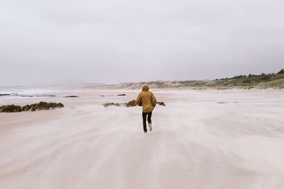 Man running on beach
