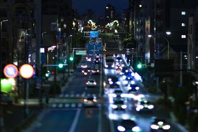 Illuminated city street at night