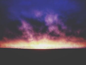 Scenic view of landscape against cloudy sky