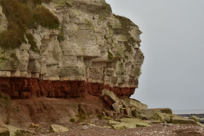 Scenic view of cliff against clear sky