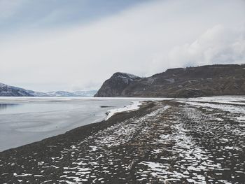 Scenic view of sea against sky during winter