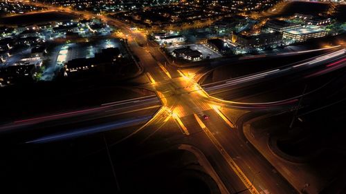 High angle view of light trails on road at night