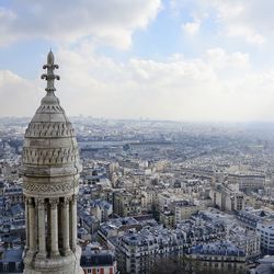 Aerial view of city buildings against sky