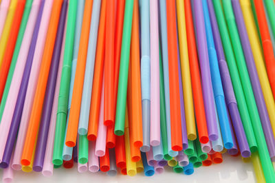 Close-up of colorful drinking straws on table