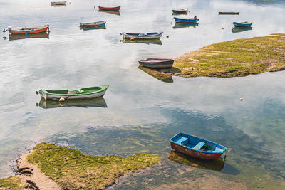 Boats moored at beach